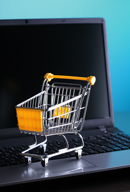 Online shopping e-commerce shopping cart with notebook